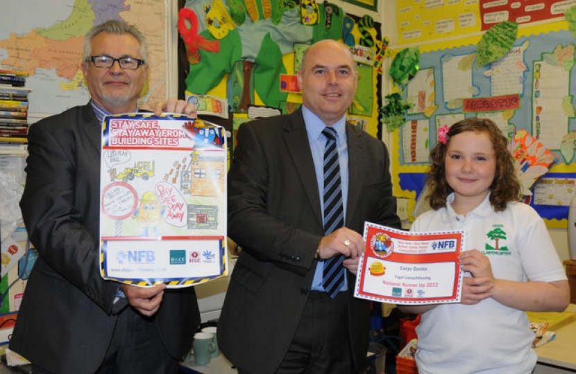 Local Assembly Member Paul Davies has visited Ysgol Llanychllwydog in Pontfaen, to present nine-year old Cerys Davies with a prize for winning the National Federation of Builders' 2012 "Stay Safe, Stay Away" poster competition, for the whole of Wales