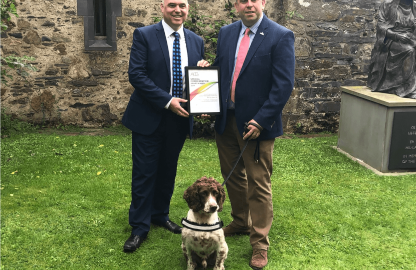 PIC CAP (L-R): Local AM Paul Davies is pictured with Stuart Phillips and Scamp