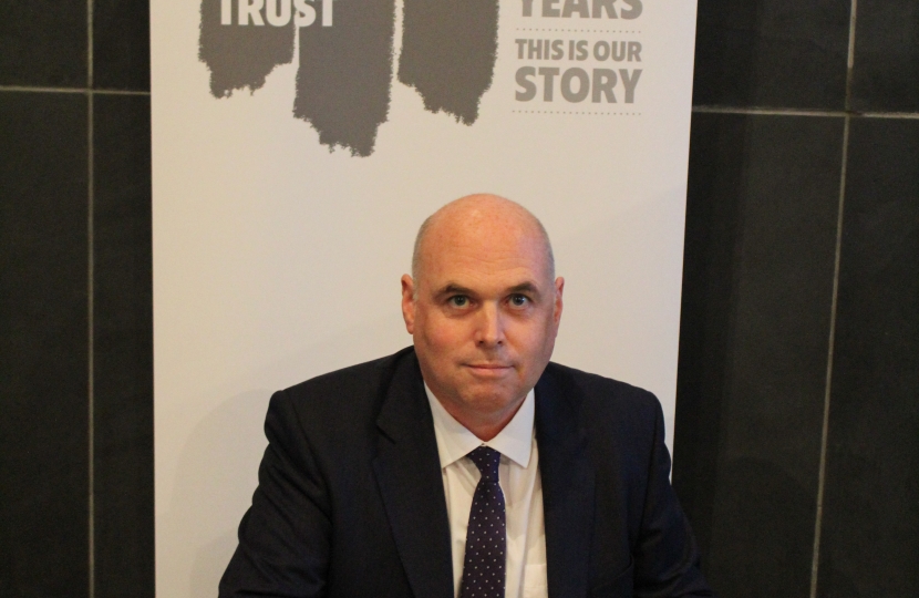 Paul Davies signing the Holocaust Book of Commitment